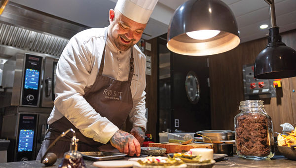Chef Douglas Spiik in the kitchen of Rost onboard the Trollfjord. Chef Douglas Spiik in the kitchen of Rost onboard the Trollfjord.