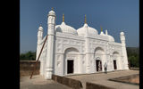 The white-washed 18th-century mosque of Khushbagh is set in the garden-cemetery of the Nawabs of Bengal, near the western banks of Hooghly River.