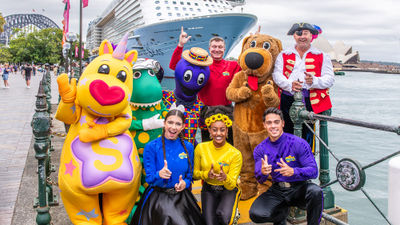The Wiggles cast in front of Royal Caribbean's Ovation of the Seas.