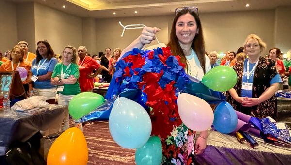 Lindley Diecks, an advisor with Greater Pittsburgh Travel, holds up a pinata that her advisor team crafted during the ALGV Pros on the Go give-back activity. Lindley Diecks, an advisor with Greater Pittsburgh Travel, holds up a pinata that her advisor team crafted during the ALGV Pros on the Go give-back activity.