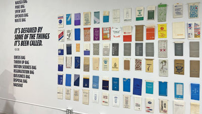 A selection of airsickness bags from the collection of Eli Cox, a retired University of Texas at Austin professor who began collecting them in the late 1960s.