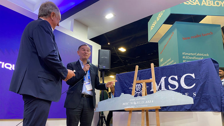 MSC Cruises executive chairman Pierfrancesco Vago (left) prepares to sign a steel outline of the MSC World Asia with Chantiers de l'Atlantique general manager Laurent Castaing.