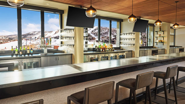 The hotel's Saddle Lounge is located on the lobby level facing the slopes.