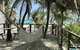 A hammock is located on the balcony of the master bedroom inside the Secrets Tulum Villa.