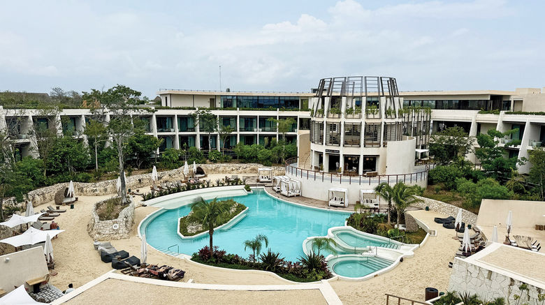 An overview of the main pool area and property complex at Secrets Tulum Resort & Beach Club, a Hyatt all-inclusive resort.