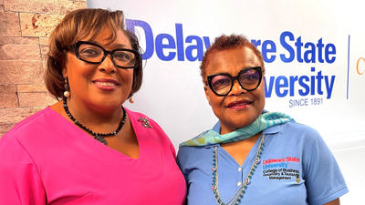 Sanya Weston, CEO of Your Premier Travel Group, has designed a travel advisor track for Delaware State University's Hospitality and Tourism Management school. With her is the department's program director, June E. Clarke.