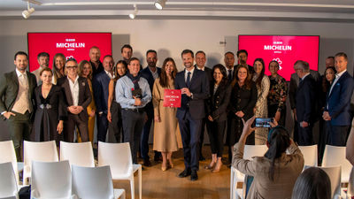 A group of hotel representatives from Michelin Guide's inaugural list of Michelin Key winners in the U.S. Michelin Guide international director Gwendal Poullennec is holding the plaque.