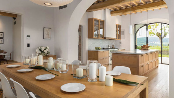 The dining and kitchen space at one of the villa properties at Casali di Casole, a Timbers Resort estate in Italy.