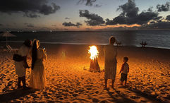 Guests attending a bonfire dinner at Sailrock's restaurant The Cove on South Caicos island. S'mores optional.