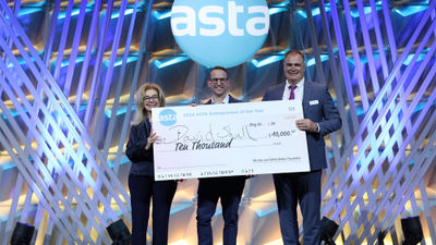 David Shull (center) won the 2024 ASTA Entrepreneur of the Year award at the ASTA Travel Advisor Conference. He was joined on stage by Gloria Bohan (left) and ASTA CEO Zane Kerby.