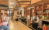 Guests gather at the resort's Three Jewels Rum Bar, where a variety of spirits, including a selection of local Eastern Caribbean rums, are on offer.