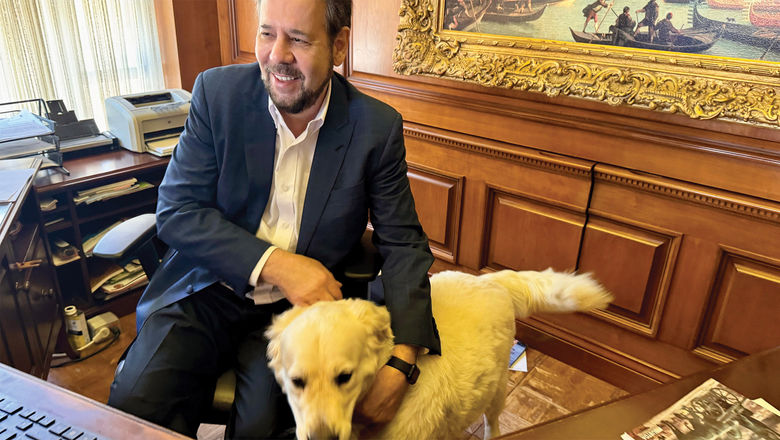 Steve Perillo, owner of Perillo Tours, brings his five-year old white Labrador Romeo to the company's Woodcliff, N.J. office every day.