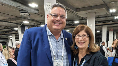 Signature Travel Network CEO Alex Sharpe with Pack for a Purpose founder Rebecca Rothney (right).