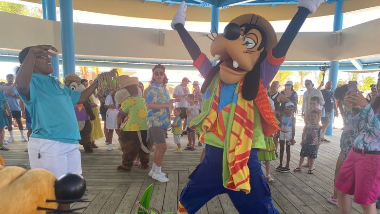 Goofy in a celebratory mood on Disney's Lookout Cay at Lighthouse Point.