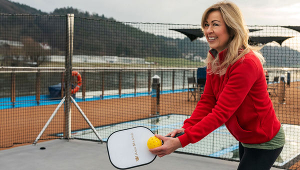 AmaWaterways co-founder Kristin Karst playing pickleball on the AmaMagna.