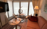 The living room area of a Medallion Suite aboard the Silver Nova.