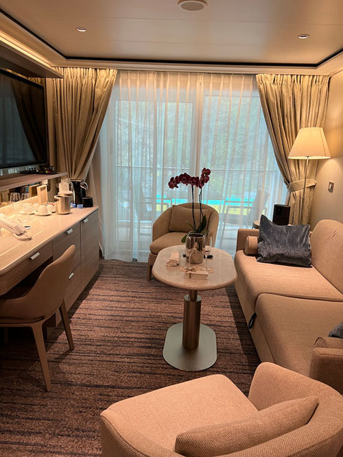The living room area of a Medallion Suite aboard the Silver Nova.