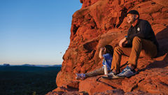 The author's daughter and Adventures by Disney guide Michael Hage contemplate the landscape on a sunrise hike in Sedona, Ariz.