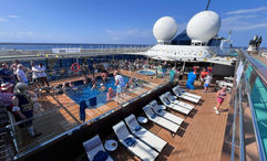 A view of the pool deck of Atlas Ocean Voyages’ World Traveller as the Venetian tea dance party began.