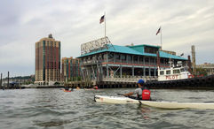 The pier in Yonkers, N.Y., with a kayaker bearing the initials for the Yonkers Paddling and Rowing Club on their life vest. Could this city, just up the Hudson River from Manhattan, one day host a river cruise ship?