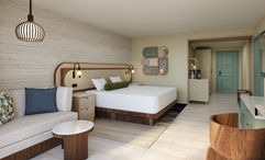 A rendering of a King Room at the Wyndham Grand Rio Mar Rainforest Beach & Golf Resort.