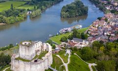 A Tauck riverboat docked near Chateau Gaillard on the Seine River.