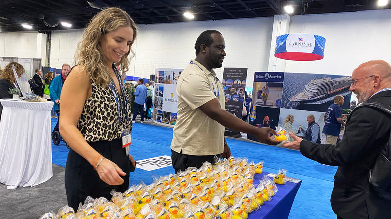 This year's CruiseWorld had the largest turnout on record, with 1,400 people attending. That translated to a bustling trade show with 175 exhibiting companies. Advisors headed to booths representing cruise lines, hotels, resorts, destinations, touring companies, services and specialty organizations. Pictured from left, Kimberly Bertsch and Tavares Sheely, customer relations specialists for Port Everglades, stand ready to pass out cruise duckies to travel advisors. Their aim was also to tell sell advisors on how convenient the port is to cruise out of due to its proximity to the Fort Lauderdale Airport and the variety of lines cruising out of Port Everglades.