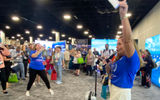 Carmen Roig, vice president of sales for Princess Cruises, raffles off one of two free cruises. Carnival Corp. brands gave away six cruises across its four brands, along with two VIP tours of the not-yet-opened Celebration Key.