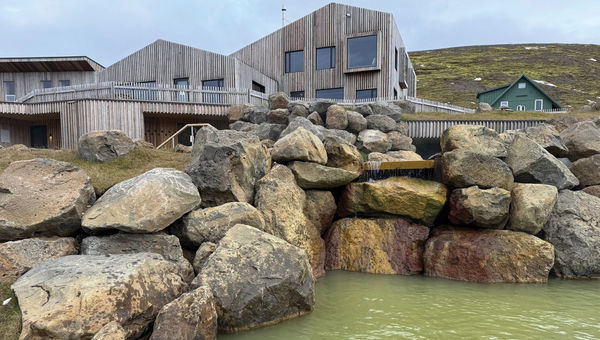 The geothermal baths at Highland Base, with the hotel's main restaurant and lounge in the background. The geothermal baths at Highland Base, with the hotel's main restaurant and lounge in the background.
