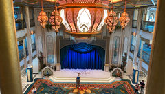 The atrium on the Disney Treasure features ornate lighting inspired by the movie "Aladdin."