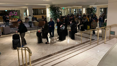 The line for check-in at the Hilton Los Angeles Airport on Jan 8. Airbnb has announced that it is offering free, temporary housing for people who have been displaced by the Los Angeles wildfires.