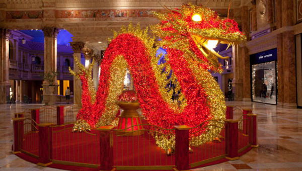 A 22-foot-long dragon, covered in 30,000 LED lights, is a tradition at the Forum Shops at Caesars. A 22-foot-long dragon, covered in 30,000 LED lights, is a tradition at the Forum Shops at Caesars.