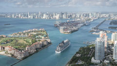 A cruise ship sails into PortMiami, the world's busiest cruise port.