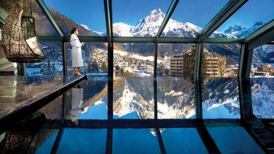 The rooftop infinity pool and whirlpool at the Kempinski Palace Engelberg offer breathtaking vistas.