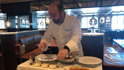 Chef Renald Macouin prepares steak tartare tableside. It is one of the dishes that will be on the menu in the revitalized Jacques restaurant on Oceania's Allura.