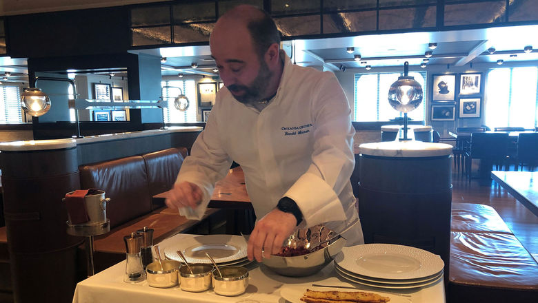 Chef Renald Macouin prepares steak tartare tableside. It is one of the dishes that will be on the menu in the revitalized Jacques restaurant on Oceania's Allura.