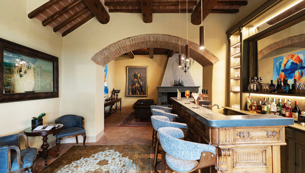 The reclaimed vintage bar, where aperitifs are served nightly. The reclaimed vintage bar, where aperitifs are served nightly.