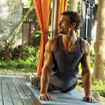 A wellness-related scene from season three of "The White Lotus," featuring Laurie (played by Carrie Coons) and her "health mentor," Valentin (played by Arnas Fedaravicius).