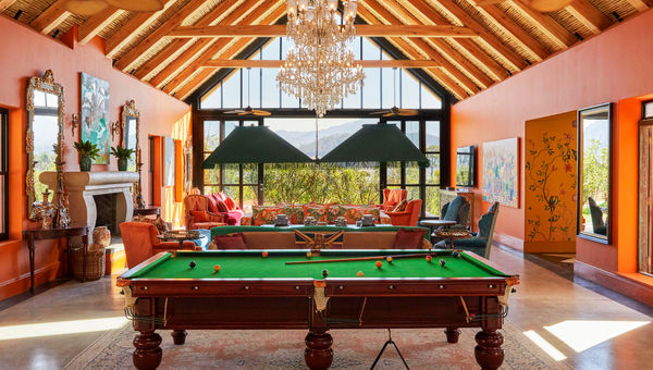 The long room of Franschhoek House is a common space with bars, lounges and full -size billiards tables.