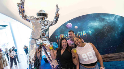 Guests celebrate the grand opening of Universal Orlando Resort's Universal Terra Luna Resort on March 25.