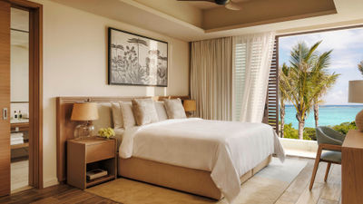 A bedroom within a residential villa at the One&Only Le Saint Geran in Mauritius
