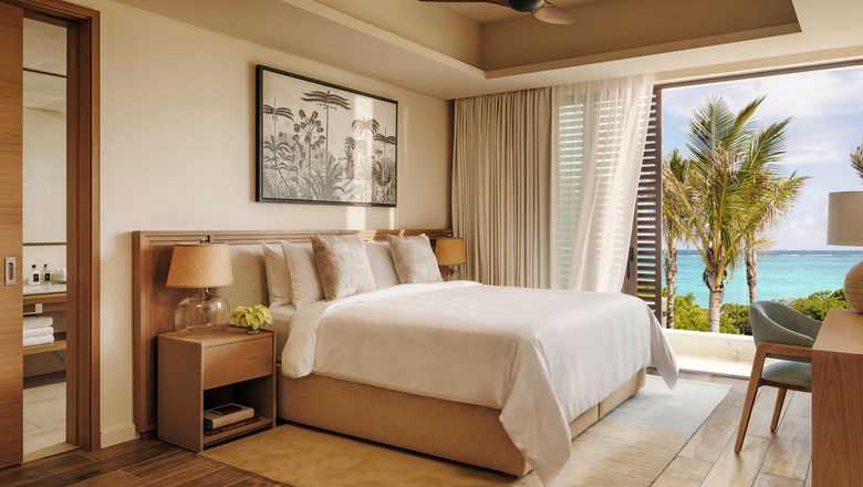 A bedroom within a residential villa at the One&Only Le Saint Geran in Mauritius