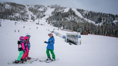 Instruction near one of the covered, surface-level carpet conveyors at the Greenhorn Ranch learning area at Colorado’s Steamboat Resort.