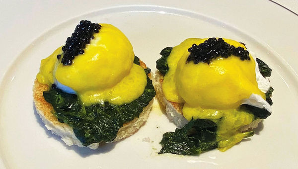 Breakfast at Fil Rouge included poached eggs atop creamed spinach with yuzu hollandaise and caviar.