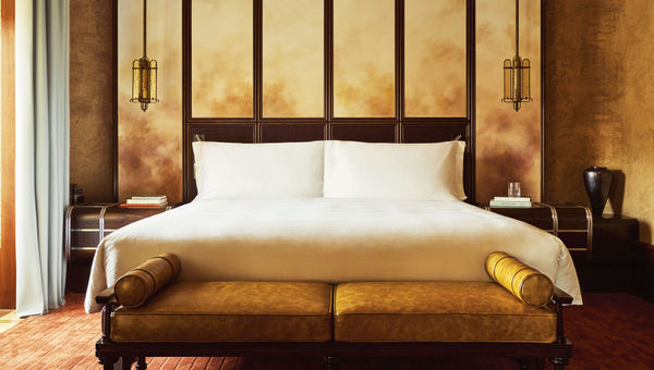 A suite bedroom at the Orient Express La Minerva.
