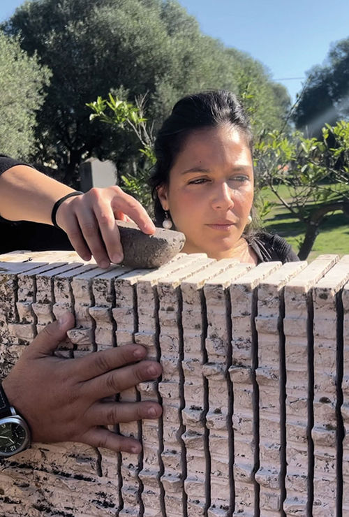 Maria, daughter of sculptor Pinuccio Sciola, guides visitors through the park. Maria, daughter of sculptor Pinuccio Sciola, guides visitors through the park.