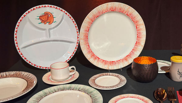 Dinnerware for the Lion King restaurant, including a plate for kids decorated with Rafiki's vision of a lion cub. Dinnerware for the Lion King restaurant, including a plate for kids decorated with Rafiki's vision of a lion cub.