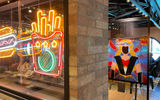 Luna Park Pizza & Burger would fit into any amusement park with an array of complimentary handhelds and plenty of neon.