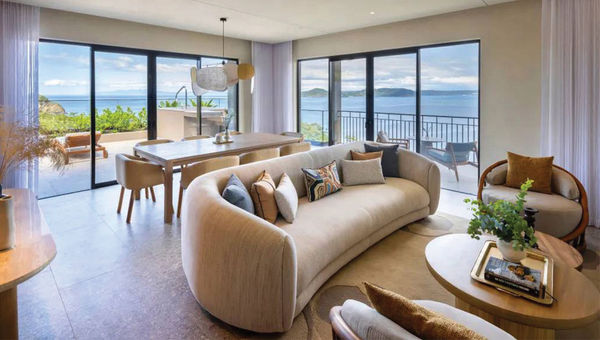 The living room and terrace in an Ocean King one-bedroom suite at the Waldorf Astoria Costa Rica Punta Cacique.