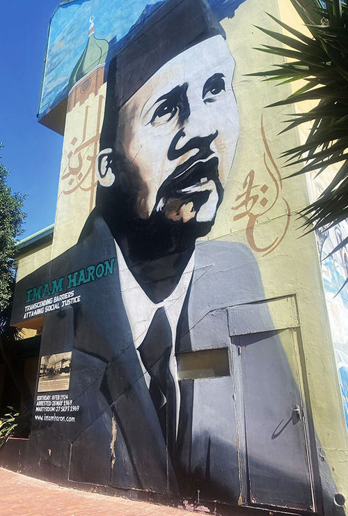 The murals of IMAM HARON outside the Community House respect the anti -Apa Lartheid activist who died during police detention in 1969. The murals of IMAM HARON outside the Community House respect the anti -Apa Lartheid activist who died during police detention in 1969.